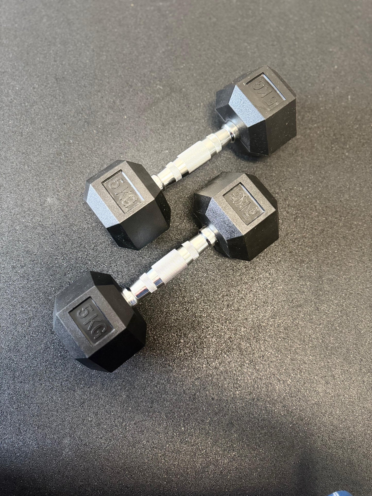 Pair of hex dumbbells on a concrete floor
