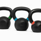 Three black kettlebells with colored bands on a white background