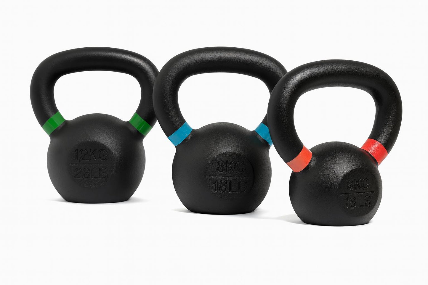 Three black kettlebells with colored bands on a white background