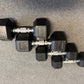 Pair of hexagonal dumbbells on a gray surface