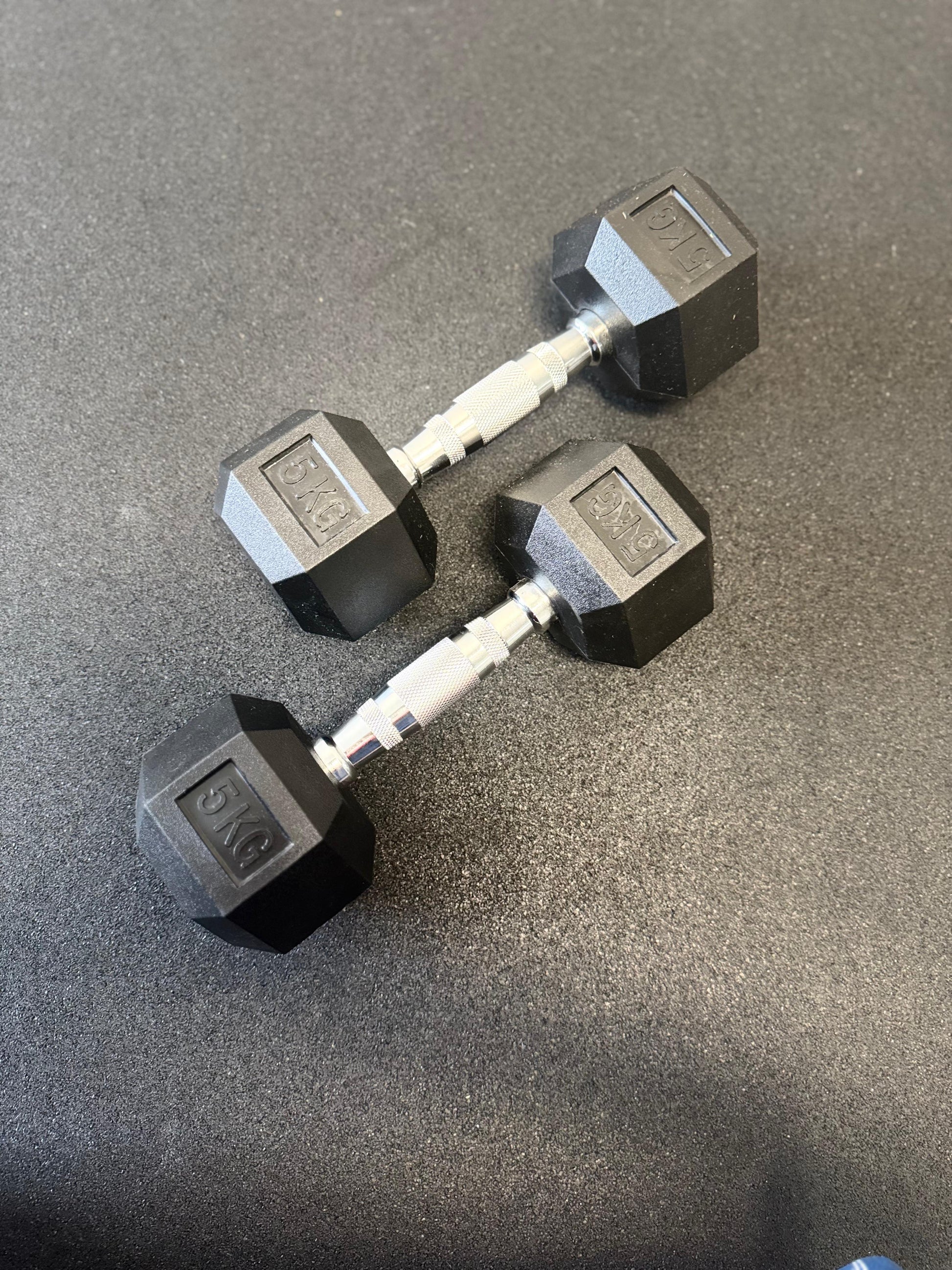 Pair of hex dumbbells on a concrete floor