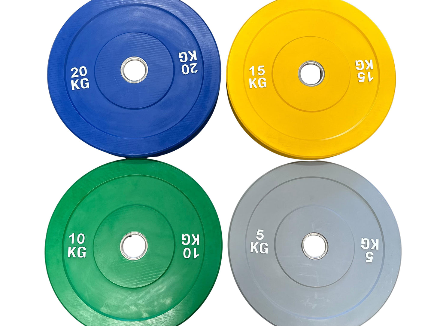 Four weight plates in blue, yellow, green, and gray with labeled weights on a white background.