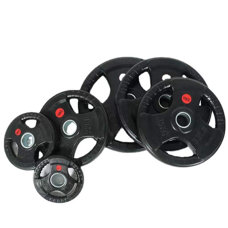 Set of black weight plates with red labels on a white background