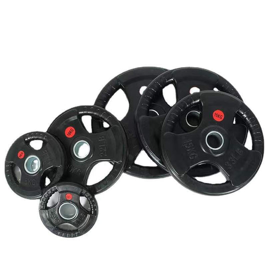 Set of black weight plates with red labels on a white background